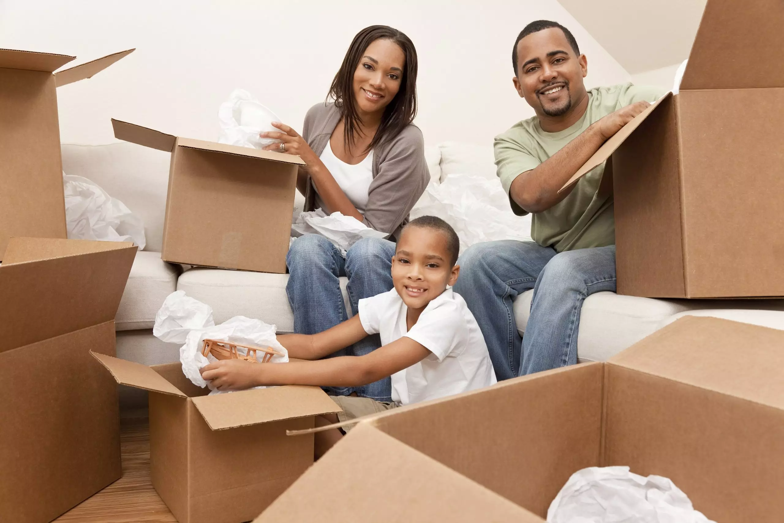 African american family unpacking boxes